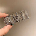 Silver bow pleated bb clip featuring hot rhinestone details in a sleek structured design with silver rhinestones