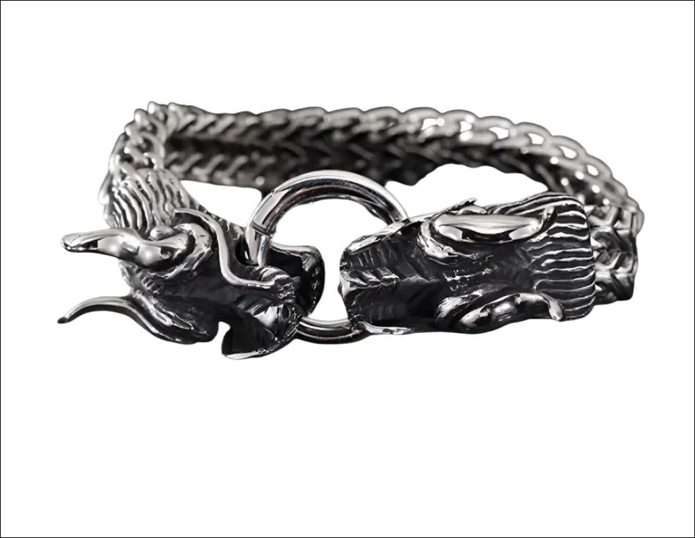 Silver braided double dragon bracelet featuring intricate detailing and a braided chain design in silver metal