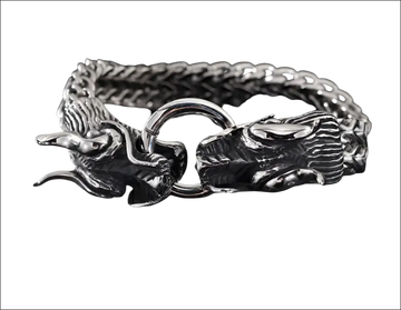 Silver braided double dragon bracelet featuring intricate detailing and a braided chain design in silver metal
