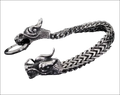 Silver braided double dragon bracelet featuring a silver dragon-themed keychain with intricately detailed heads and braided chain