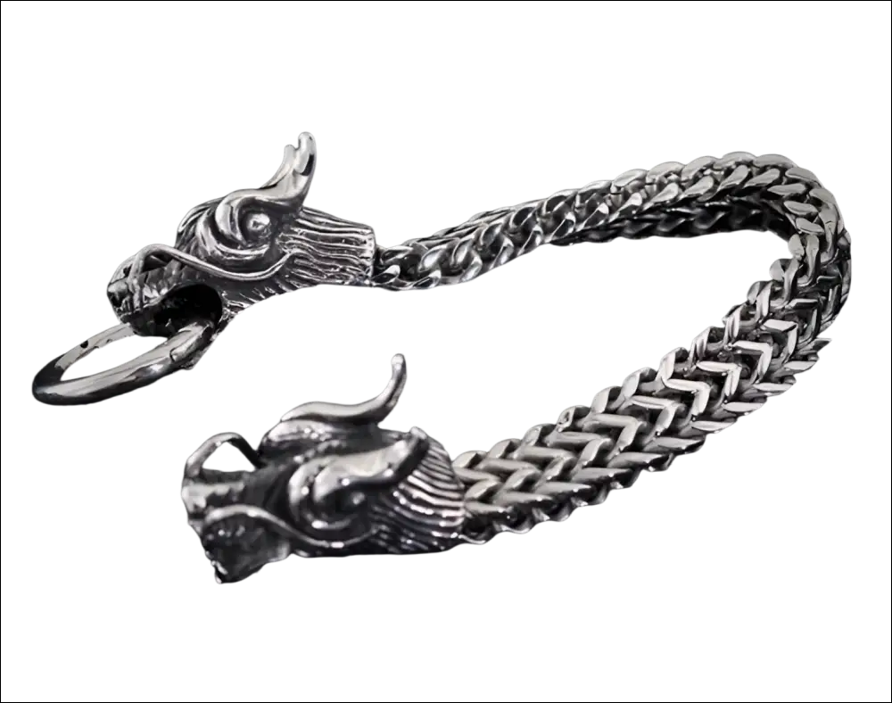 Silver braided double dragon bracelet featuring a silver dragon-themed keychain with intricately detailed heads and braided chain