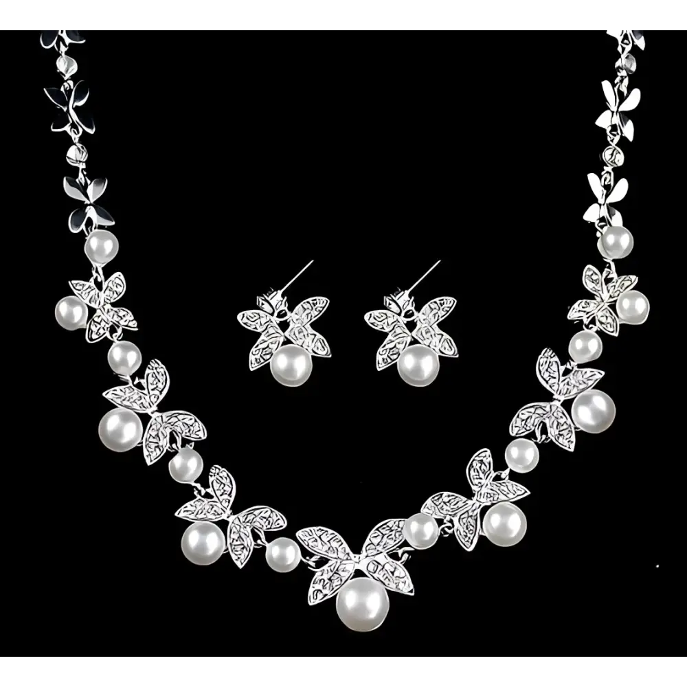 Silver butterfly bride necklace and earrings set with pearls and crystal embellishments for bride wedding jewelry
