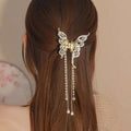 Gold-toned butterfly grab clip with sparkling rhinestones and pearl drops, elegant temperament bow tassel accessory