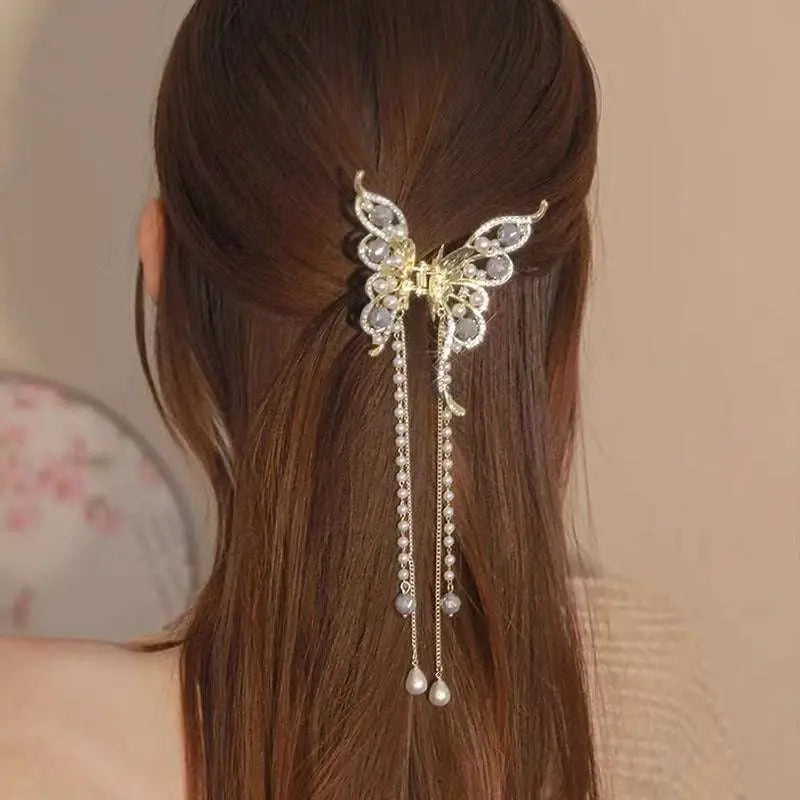 Gold-toned butterfly grab clip with sparkling rhinestones and pearl drops, elegant temperament bow tassel accessory