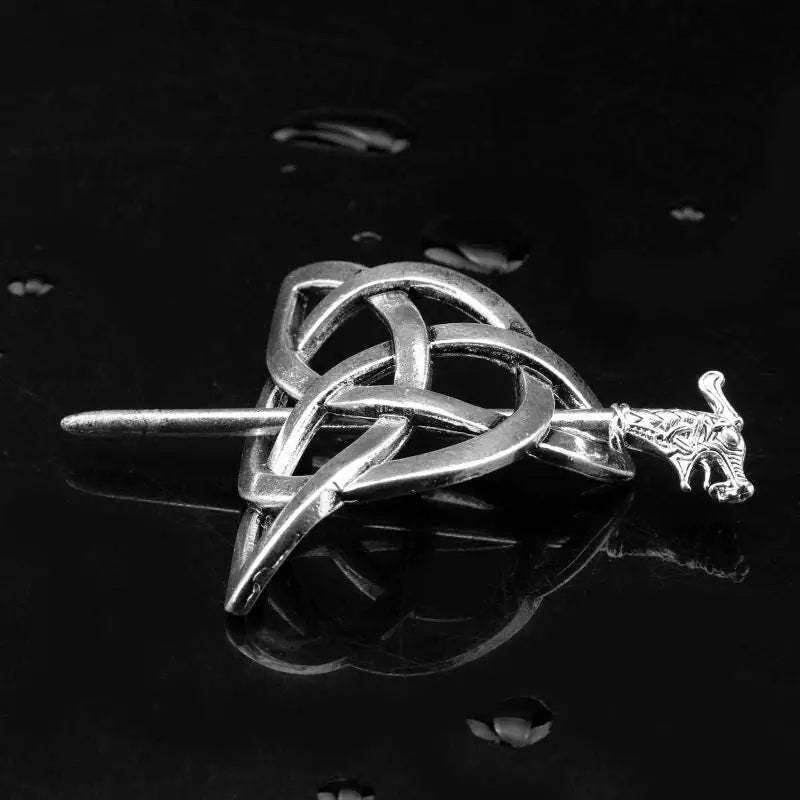 Silver celtic knot metal hair clip featuring an intricate interwoven design and detailed dragon head in silver metal