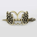 Antique brass-colored metal hair clip with intricate silver celtic knot design for retro style hair accessory