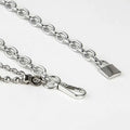 Silver chain belt featuring a padlock charm and carabiner clip as summer body jewelry for jewelry hip hop style