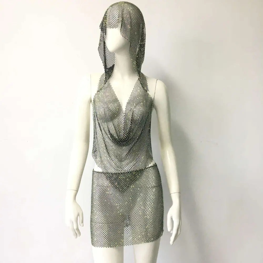 Silver chainmail halter top and mini skirt set featuring a fishnet rhinestone tight design in a silver rhinestone tight suit
