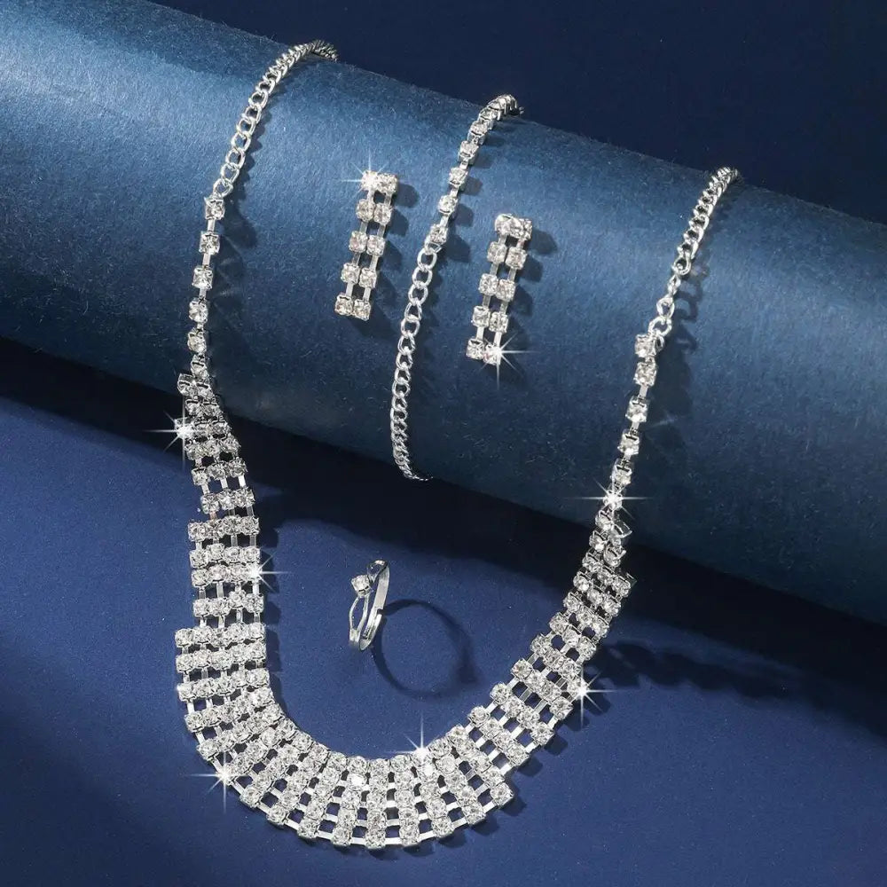 Silver claw chain necklace with cascading multi-row rhinestones and clear crystals in geometric design from bracelet earrings ring set