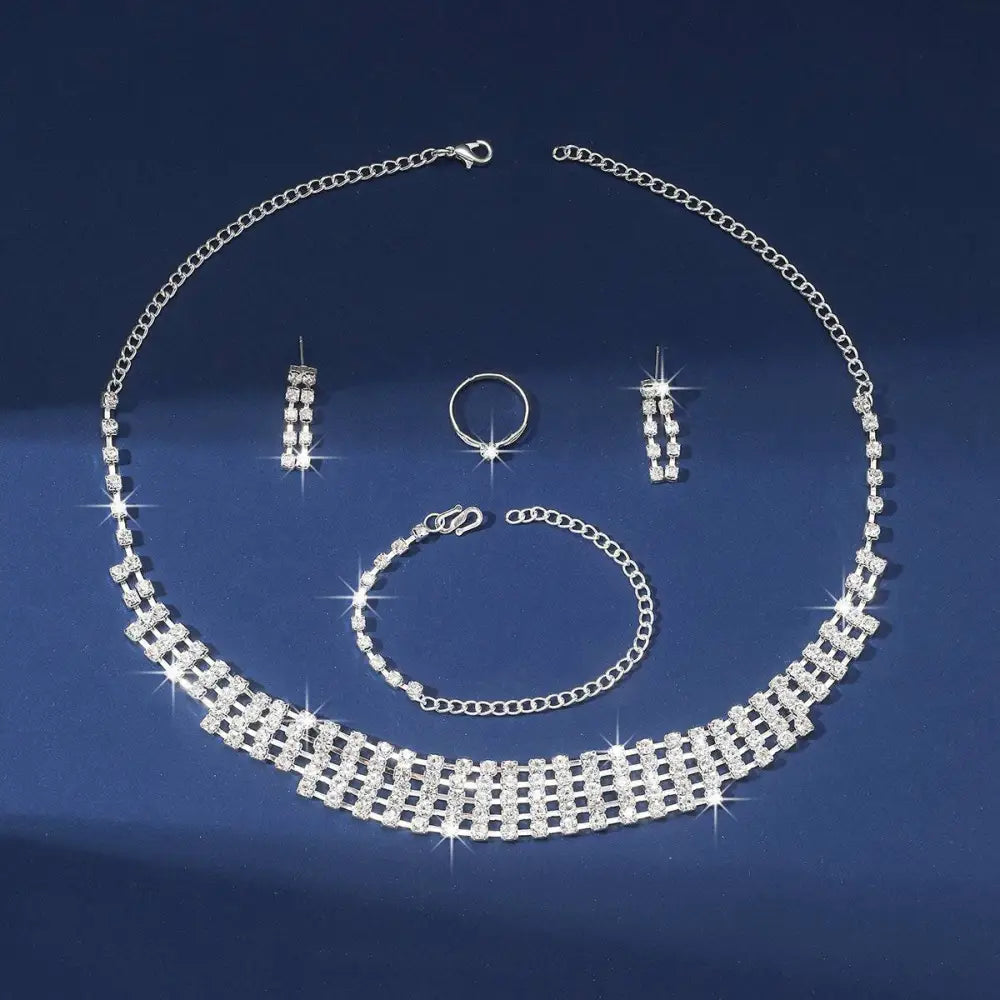 Sparkling silver claw chain necklace with geometric rhinestone lattice design included in bracelet earrings ring set