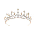 A delicate silver crown rhinestone pearl tiara with gold-toned metal, clear crystals, and lustrous pearls baroque headwear