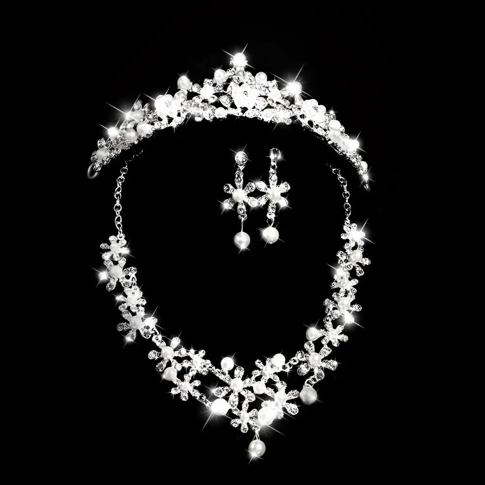 Silver crystal alloy headdress bridal crown adorned with crystals and pearls paired with matching floral earrings