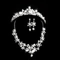 Sparkling silver crystal alloy headdress bridal crown adorned with crystals and pearls paired with matching earrings