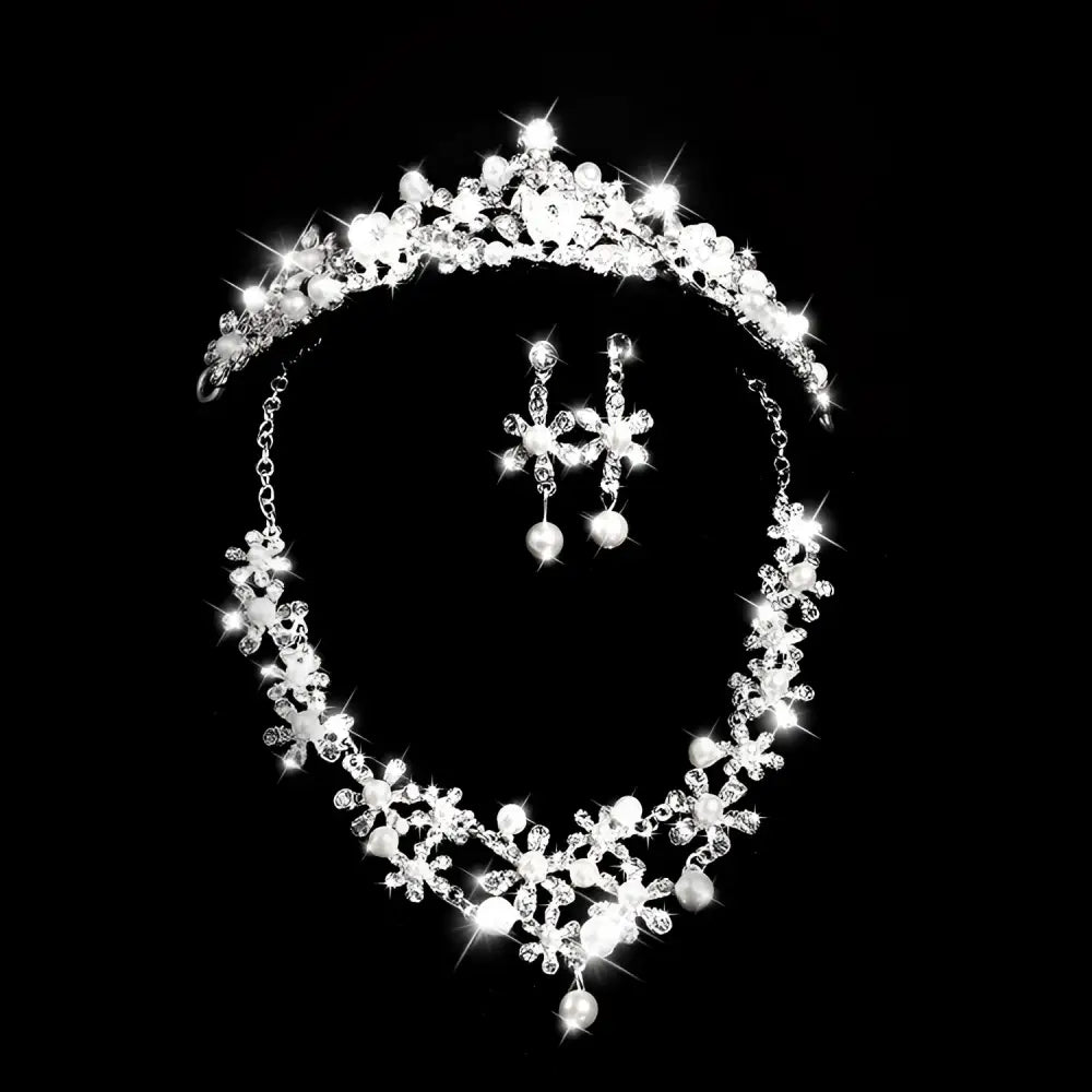 Sparkling silver crystal alloy headdress bridal crown adorned with crystals and pearls paired with matching earrings