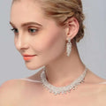 A silver crystal choker wedding jewelry set featuring a cascading crystal design with matching dangling earrings