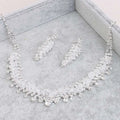 Silver crystal choker wedding jewelry set with intricate cascading crystal design in a soft gray velvet box