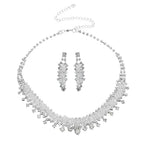 Silver crystal choker wedding jewelry set with cascading crystal design in metallic silver-toned metal with matching earrings