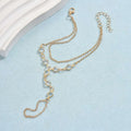 Gold-toned double-layer chain anklet with circular links and lobster clasp featured in silver crystal fashion minimalist bracelet ring collection
