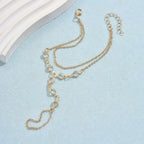 Gold-toned double-layer chain anklet with circular links and lobster clasp featured in silver crystal fashion minimalist bracelet ring collection