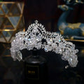 A sparkling silver bridal crown baroque adorned with clear faceted crystal flowers and crystal leaf bridal details