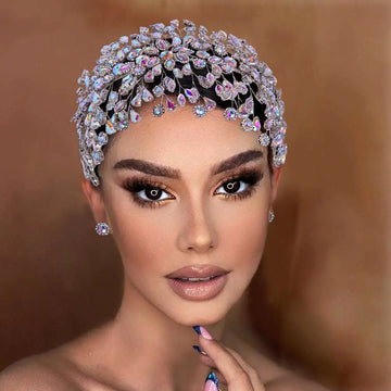 A silver crystal leaf styling hair accessory with sparkling teardrop stones and an intricate elegant design