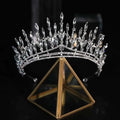 A silver crystal makeup headdress super beautiful crown with elongated and round-cut crystals in a leaf-like design