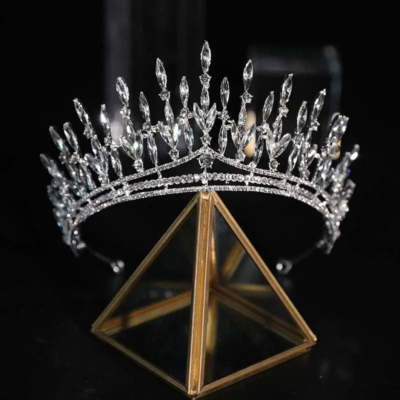 A silver crystal makeup headdress super beautiful crown with elongated and round-cut crystals in a leaf-like design
