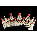 A sparkling gold wedding crown headdress with vibrant red gemstones and intricate crystals for silver crystal queen bridal use