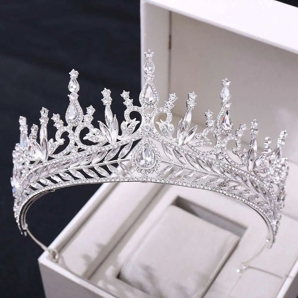 A sparkling silver crystal wedding hair hoop crown with intricate leaf and teardrop-shaped crystal embellishments