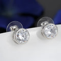 Silver cubic zirconia stud earrings with round clear stones in a sleek metallic bezel from zirconia bride fashion accessories jewelry set