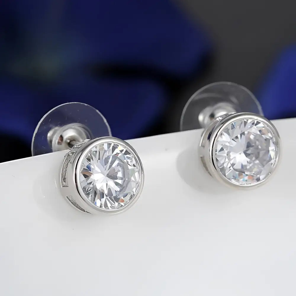 Silver cubic zirconia stud earrings with round clear stones in a sleek metallic bezel from zirconia bride fashion accessories jewelry set