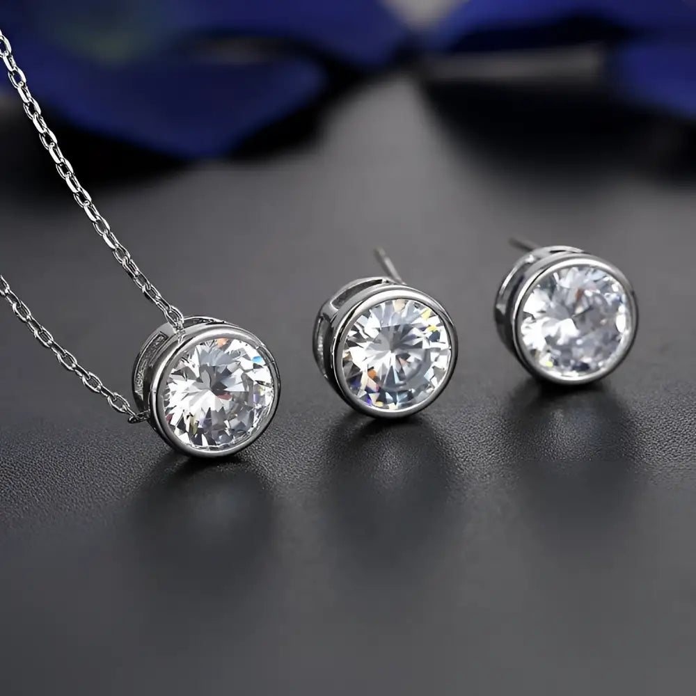 Silver cubic zirconia bride fashion accessories jewelry set featuring silver-toned stud earrings and matching pendant necklace