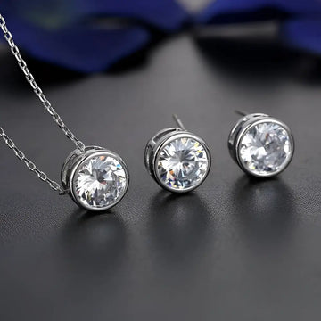Silver cubic zirconia bride fashion accessories jewelry set featuring silver-toned stud earrings and matching pendant necklace
