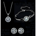 Silver diamond jewelry set featuring a silver-toned necklace bracelet and earrings with central diamonds and pave stones