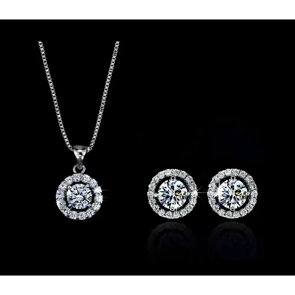 Silver diamond jewelry set featuring a silver diamond halo necklace and matching stud earrings for luxury women’s fashion