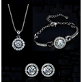 Silver diamond jewelry set featuring silver-toned necklace bracelet and earrings with round-cut clear stones surrounded by accents