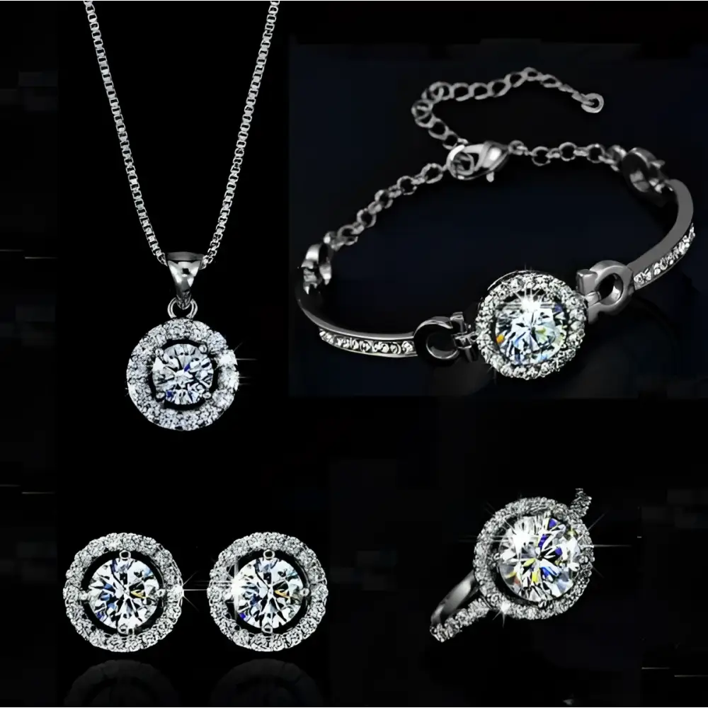 Silver diamond jewelry sets featuring a silver necklace, bracelet, earrings, and ring with sparkling circular halo stones
