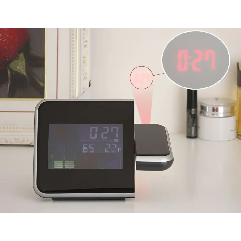 Black digital weather station with silver trim projection feature displaying red led time for home electronic clock use