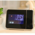 Silver digital weather station home electronic clock with black and silver design blue illuminated display showing time temperature and humidity