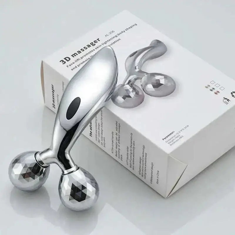 Silver facial roller massage device with two faceted gemstone-like spheres and a sleek metallic handle