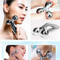 Silver facial roller massage device with two faceted gemstone-like spheres and a sleek metallic handle