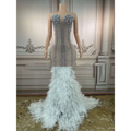 A glamorous sleeveless long gown in silver beading with feathered hips for nightclub bar events