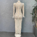 A cream-colored stretch slim dress with colorful rhinestone mesh stretch and silver feathered rhinestone cuffs