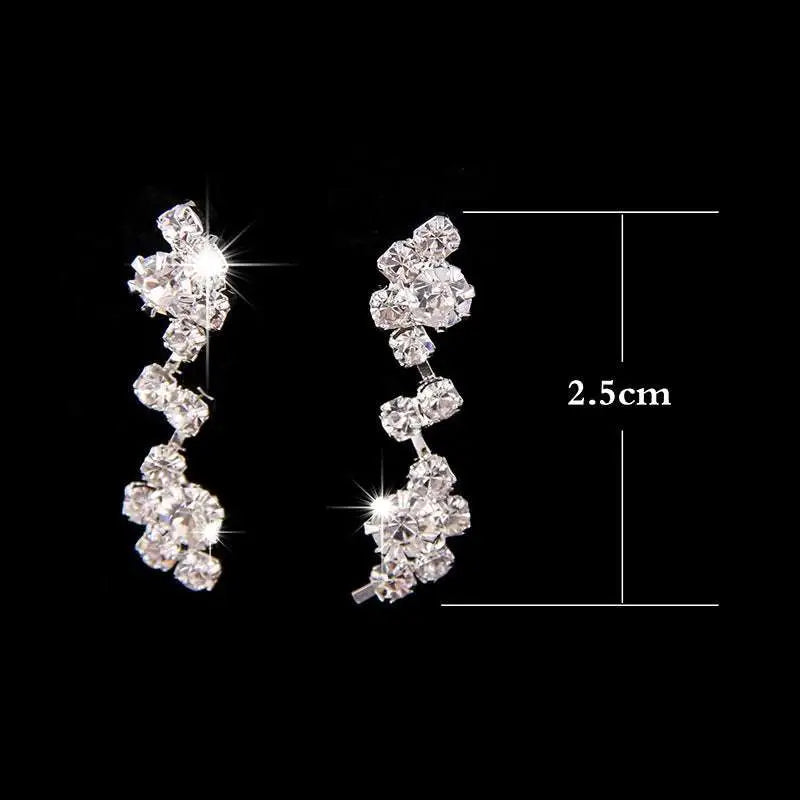 Sparkling silver floral bridal necklace earrings two piece set with delicate chain and cascading clear rhinestone clusters