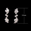 Sparkling silver floral bridal crystal drop earrings with cascading cluster design from floral bridal necklace earrings set