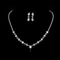 Sparkling silver floral bridal necklace earrings two piece set with delicate chain and cascading clear rhinestone clusters