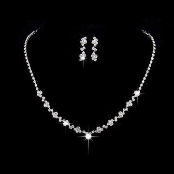 Sparkling silver floral bridal necklace earrings two piece set with delicate chain and cascading clear rhinestone clusters