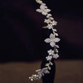 Delicate silver floral crystal zircon hair band adorned with clear crystals pearls and intricate leaf and flower motifs