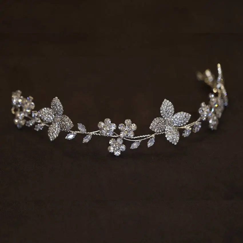 Delicate silver floral crystal zircon hair band adorned with clear crystals and pearls in intricate vine patterns
