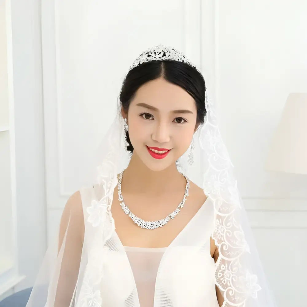 Silver-toned crystal silver floral jewelry necklace earrings set with intricate floral design and matching drop earrings